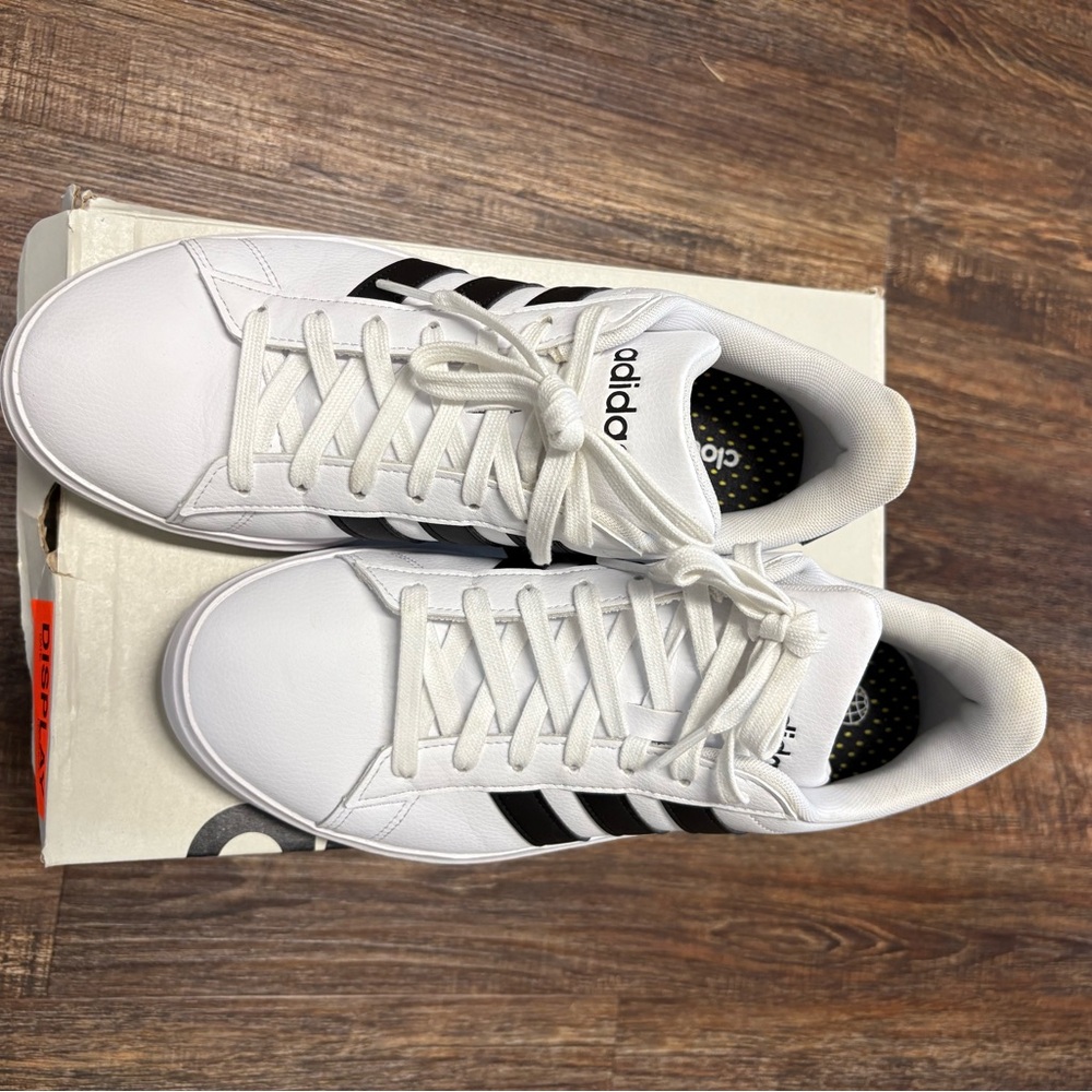 Adidas White and Black Sneakers with Iconic Stripes